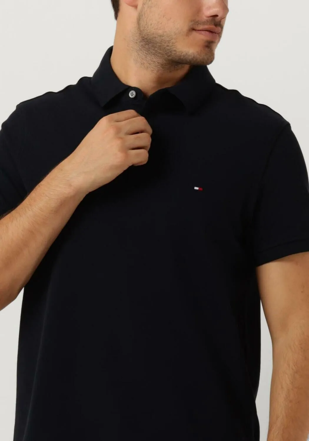 donkerblauwe tommy hilfiger polo core 1985 slim polo