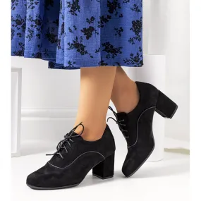 Zwarte schoenen op de Bird post